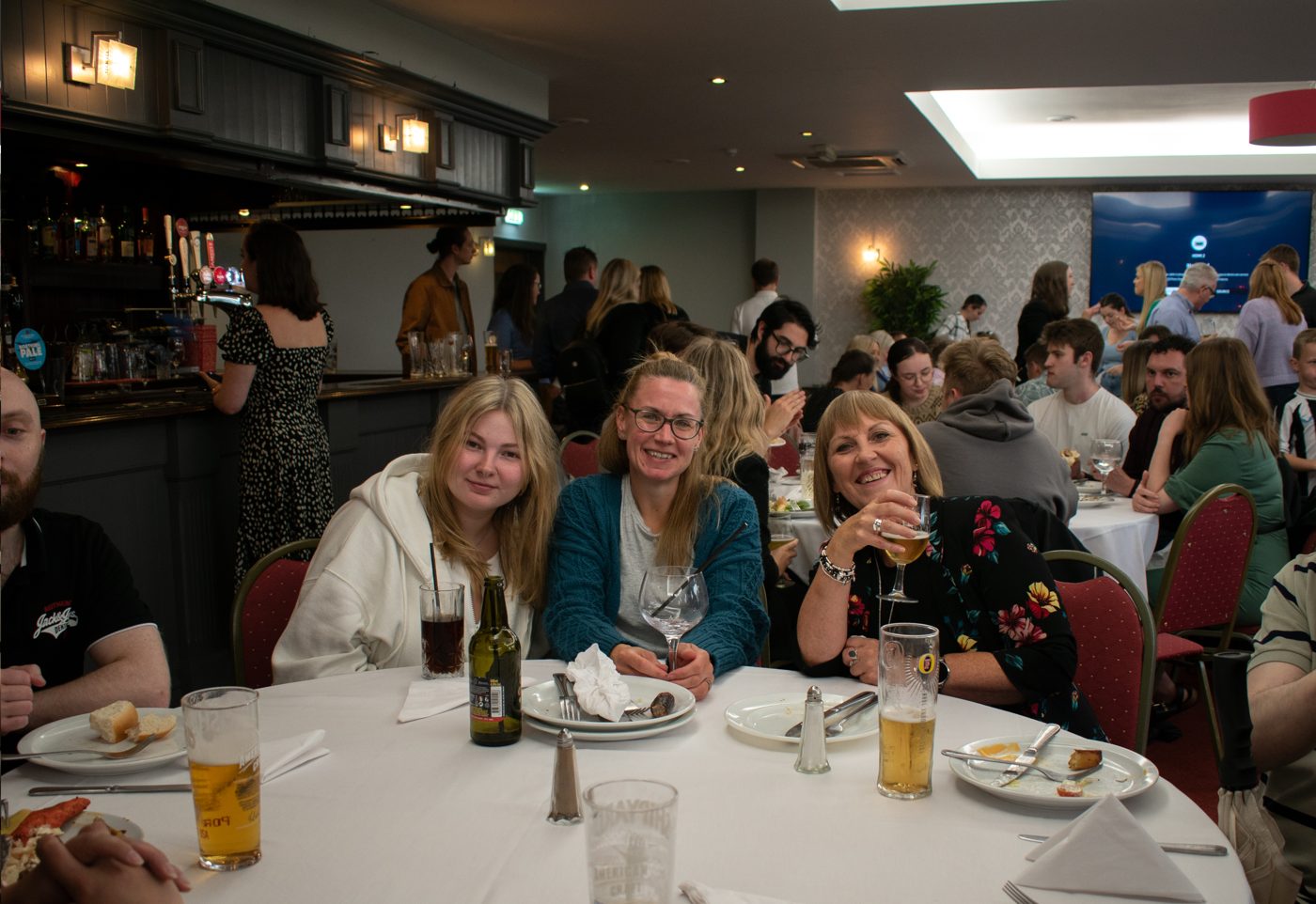Spacers celebrating together at a group dinner